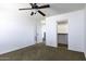 Bedroom with ceiling fan, closet, and carpet at 1340 E Kingman Pl, Casa Grande, AZ 85122