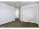 Well-lit bedroom featuring double door closet and neutral decor at 1340 E Kingman Pl, Casa Grande, AZ 85122