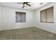 Bedroom with ceiling fan, neutral carpet, and window blinds at 1340 E Kingman Pl, Casa Grande, AZ 85122