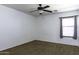 Spacious bedroom with ceiling fan and window coverings at 1340 E Kingman Pl, Casa Grande, AZ 85122