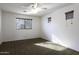 Bright bedroom with ceiling fan and window coverings at 1340 E Kingman Pl, Casa Grande, AZ 85122