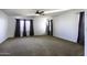 Primary bedroom with ceiling fan and carpeting at 1340 E Kingman Pl, Casa Grande, AZ 85122