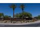 G Diamond Ranch community entrance with palm trees and landscaping at 1340 E Kingman Pl, Casa Grande, AZ 85122