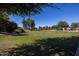 Landscaped grassy area with walking paths near homes at 1340 E Kingman Pl, Casa Grande, AZ 85122