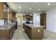 Eat-in kitchen with granite counters and ample cabinet space at 1340 E Kingman Pl, Casa Grande, AZ 85122