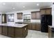 Spacious kitchen with granite countertops and dark wood cabinets at 1340 E Kingman Pl, Casa Grande, AZ 85122