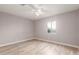 Light and airy bedroom with wood-look floors at 1340 W Romley Rd, Phoenix, AZ 85041