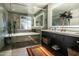 Modern bathroom with double vanity, glass shower, and soaking tub at 1440 E Secretariat Dr, Tempe, AZ 85284