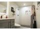 Modern bathroom with a walk-in shower and gray vanity at 1440 E Secretariat Dr, Tempe, AZ 85284