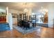 Open dining room with a wooden table and view into the kitchen at 1440 E Secretariat Dr, Tempe, AZ 85284