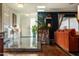Bright entryway with tile flooring, stone accent wall, and hardwood floors at 1440 E Secretariat Dr, Tempe, AZ 85284