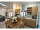 Eat-in kitchen with wood cabinets and a view at 1440 E Secretariat Dr, Tempe, AZ 85284