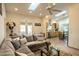 Open living room with L-shaped sofa and kitchen view at 1440 E Secretariat Dr, Tempe, AZ 85284