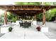 Covered outdoor kitchen and dining area with string lights and seating at 1440 E Secretariat Dr, Tempe, AZ 85284