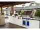 High-end outdoor kitchen featuring stainless steel appliances at 1440 E Secretariat Dr, Tempe, AZ 85284