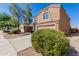 Two-story house with tan exterior, two-car garage, and landscaping at 14804 N 129Th Dr, El Mirage, AZ 85335