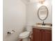 Updated bathroom with an oval mirror and modern vanity at 1571 W Orchid Ln, Chandler, AZ 85224