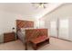 Main bedroom with wood-paneled headboard and double doors at 1571 W Orchid Ln, Chandler, AZ 85224