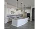 Modern kitchen featuring granite countertops and white cabinets at 18046 N Stonegate Rd, Maricopa, AZ 85138