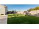 Landscaped backyard with artificial turf and trampoline at 18373 W Sells Dr, Goodyear, AZ 85395