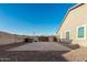 Spacious backyard with paved patio and artificial turf at 18373 W Sells Dr, Goodyear, AZ 85395