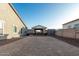 Backyard with covered patio, hot tub and storage shed at 18373 W Sells Dr, Goodyear, AZ 85395