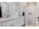 Clean bathroom with double vanity and a separate tub at 18373 W Sells Dr, Goodyear, AZ 85395