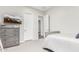 Charming bedroom with a dresser, TV, and crib at 18373 W Sells Dr, Goodyear, AZ 85395
