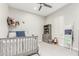 bedroom with a wooden bed and built-in shelving at 18373 W Sells Dr, Goodyear, AZ 85395