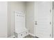 Entryway with white bench, storage and coat hooks at 18373 W Sells Dr, Goodyear, AZ 85395