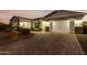 Two-car garage and well-manicured landscaping at 18373 W Sells Dr, Goodyear, AZ 85395