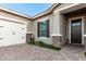 Front entrance with a two-car garage and landscaping at 18373 W Sells Dr, Goodyear, AZ 85395