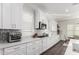 Modern kitchen with white cabinets and quartz countertops at 18373 W Sells Dr, Goodyear, AZ 85395