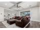 Open living room showcasing a sectional sofa, access to the kitchen and backyard at 18373 W Sells Dr, Goodyear, AZ 85395