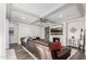 Relaxing living room with a brown leather sectional sofa and a fireplace at 18373 W Sells Dr, Goodyear, AZ 85395