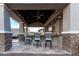 Covered patio features an outdoor kitchen and bar seating at 18373 W Sells Dr, Goodyear, AZ 85395