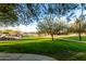 Landscaped park with mature trees and walking paths at 18373 W Sells Dr, Goodyear, AZ 85395