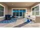 Relaxing covered patio with comfortable seating and access to backyard at 18373 W Sells Dr, Goodyear, AZ 85395