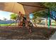 Community playground with shaded play structures at 18373 W Sells Dr, Goodyear, AZ 85395