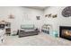 Bright playroom featuring a fireplace and comfortable seating at 18373 W Sells Dr, Goodyear, AZ 85395