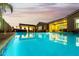 Inviting swimming pool and spa at dusk at 18373 W Sells Dr, Goodyear, AZ 85395