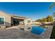 Luxury backyard oasis with a sparkling pool and spacious patio at 18373 W Sells Dr, Goodyear, AZ 85395