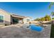 Luxury backyard oasis with a sparkling pool and spacious patio at 18373 W Sells Dr, Goodyear, AZ 85395
