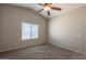 Spacious bedroom with vaulted ceilings and large window at 21129 N Grantham Rd, Maricopa, AZ 85138