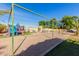 Spacious play area with playground equipment and trampoline at 23523 N 79Th Ave, Peoria, AZ 85383