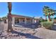 View of backyard, showcasing desert landscaping and house exterior at 2394 E Fiesta Dr, Casa Grande, AZ 85194