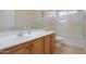 Bathroom features single sink vanity, tub and shower combo at 2394 E Fiesta Dr, Casa Grande, AZ 85194