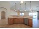 Kitchen with island, stainless steel appliances, and light wood cabinets at 2394 E Fiesta Dr, Casa Grande, AZ 85194