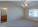 Main bedroom with ceiling fan and access to bathroom at 2394 E Fiesta Dr, Casa Grande, AZ 85194