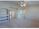 Spacious main bedroom with built-in shelves and en-suite bathroom at 2394 E Fiesta Dr, Casa Grande, AZ 85194